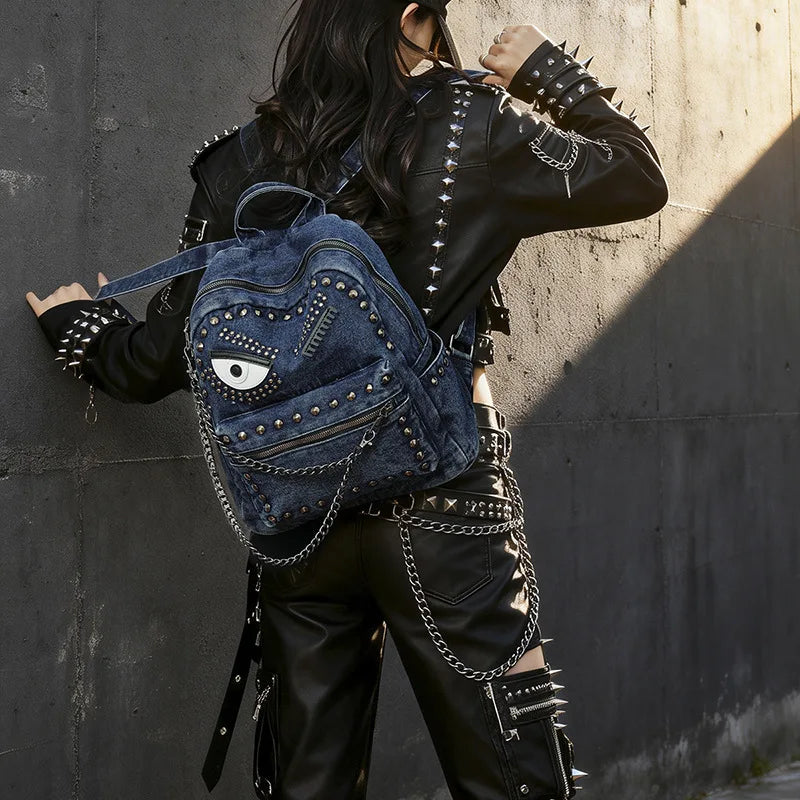 Women Punk Backpack Denim Rivet School Bag with Big Eye Design Chain Detail Grunge Goth Style Casual Travel Daypack Rucksack