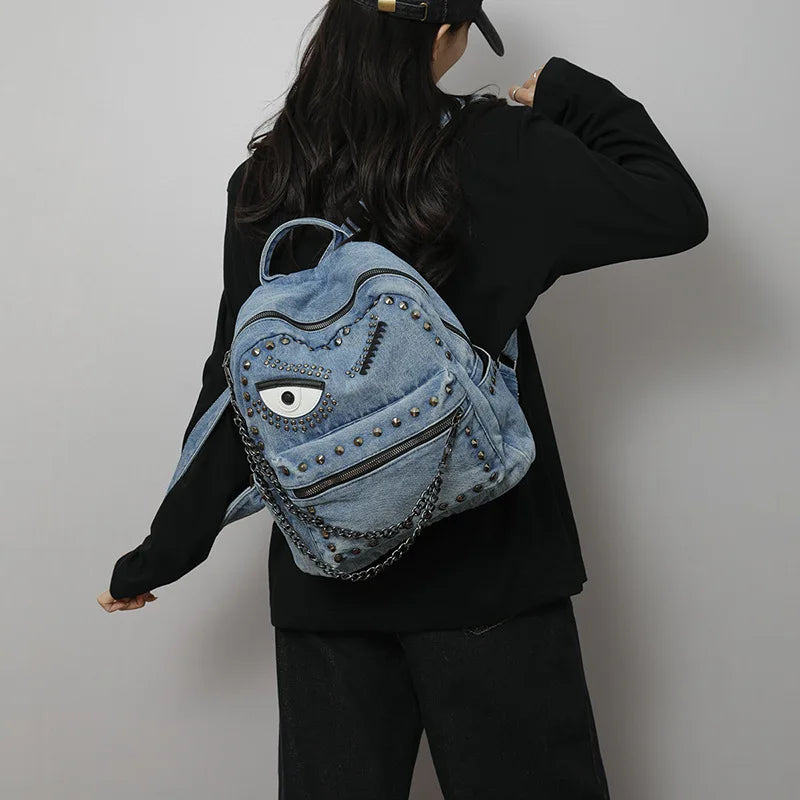 Women Punk Backpack Denim Rivet School Bag with Big Eye Design Chain Detail Grunge Goth Style Casual Travel Daypack Rucksack