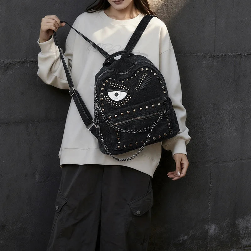 Women Punk Backpack Denim Rivet School Bag with Big Eye Design Chain Detail Grunge Goth Style Casual Travel Daypack Rucksack